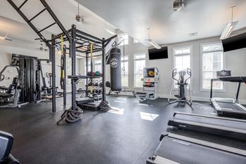 the ferry building apartments fitness center with cardio equipment and weights